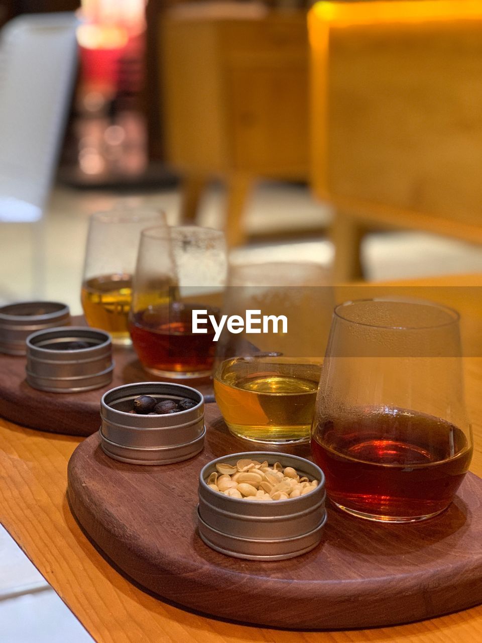 Close-up of alcohol in glasses with food on table