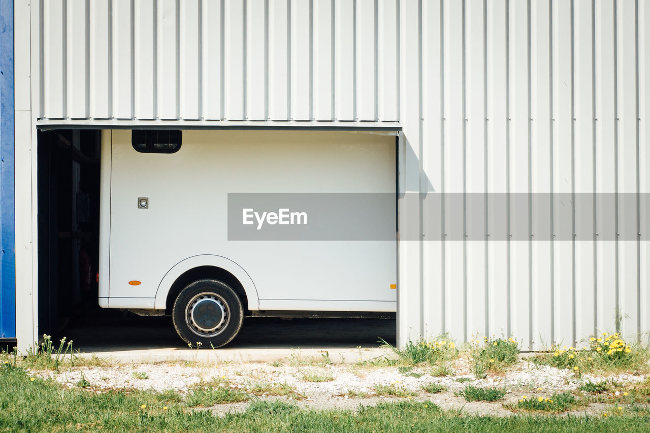 Vehicle seen through entrance of garage