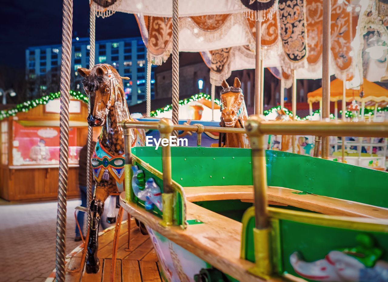 Carousel at amusement park during dusk