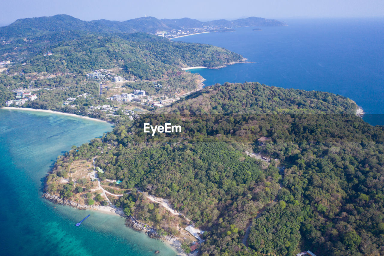 HIGH ANGLE VIEW OF BAY AND TREES