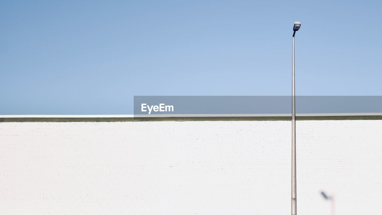 LOW ANGLE VIEW OF STREET LIGHT AGAINST SKY