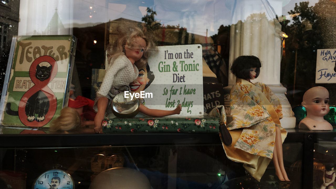 Close-up of dolls at store window