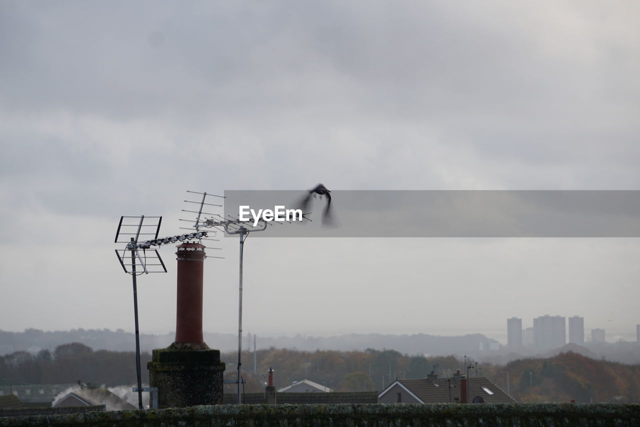 sky, architecture, cloud, built structure, nature, wind, building exterior, no people, technology, tower, building, outdoors, environment, city, electricity, landscape, day, tree, overcast, mountain