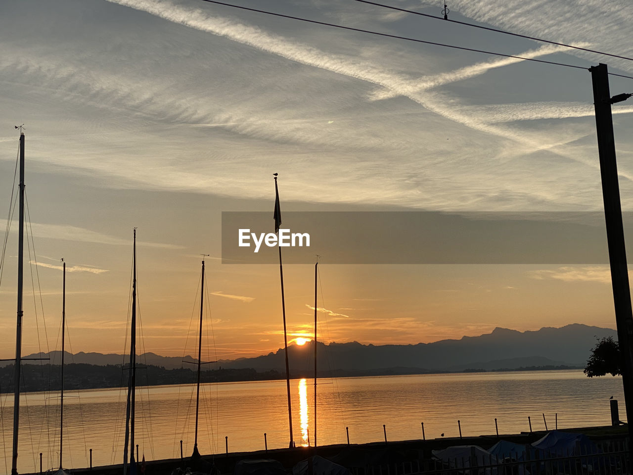 SCENIC VIEW OF SEA AGAINST ORANGE SKY