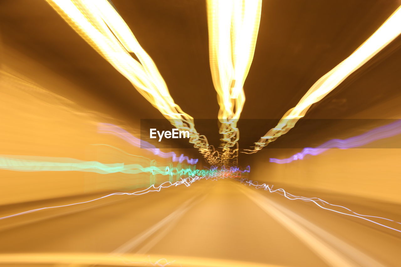 LIGHT TRAILS AGAINST SKY