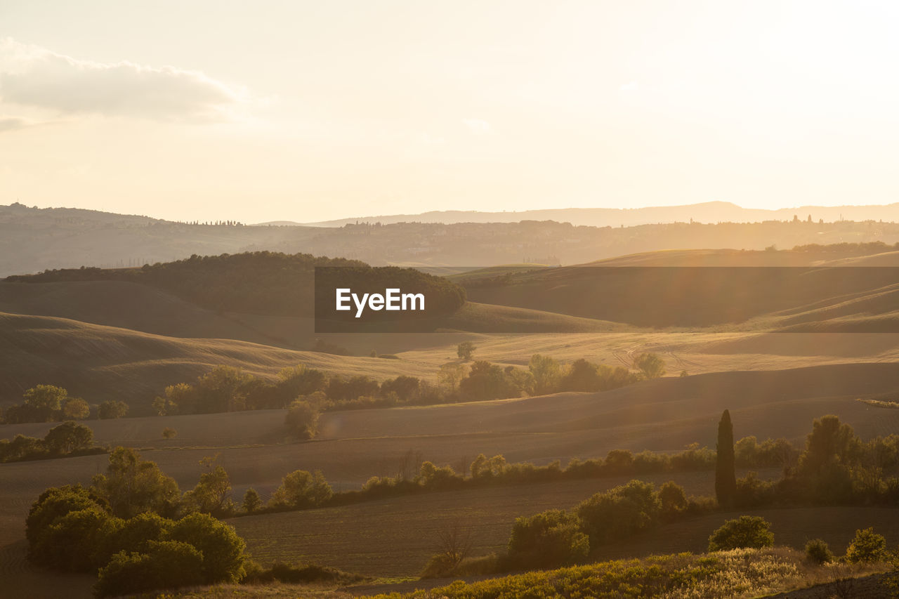 Scenic view of landscape and mountains against sky