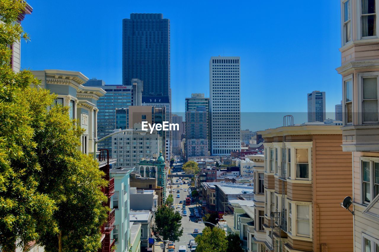 Cityscape against clear blue sky