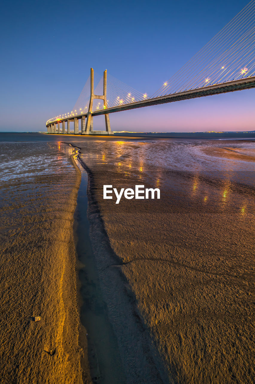 View of suspension bridge over sea