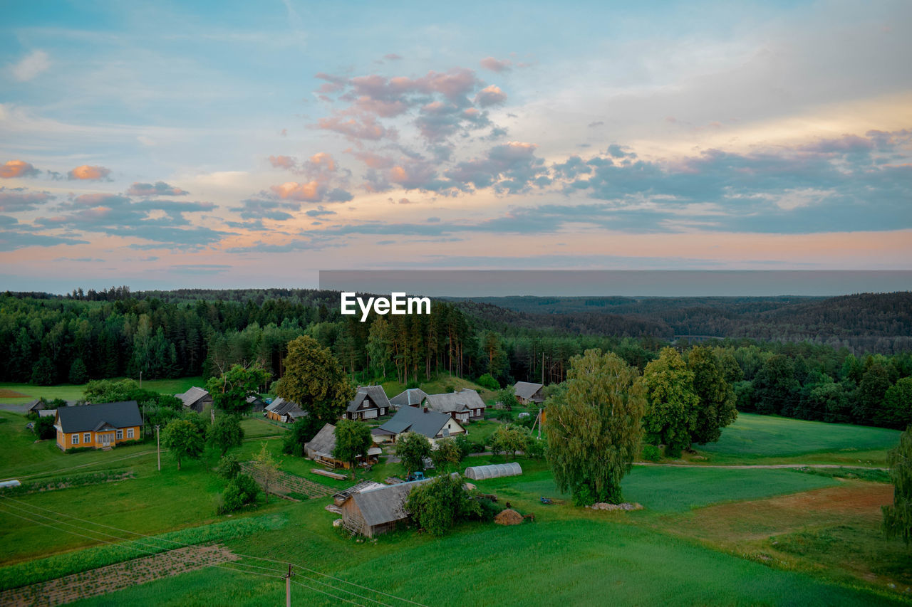 Scenic view of field against sky during sunset