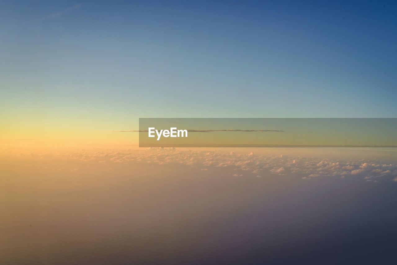 Scenic view of landscape against sky during sunset