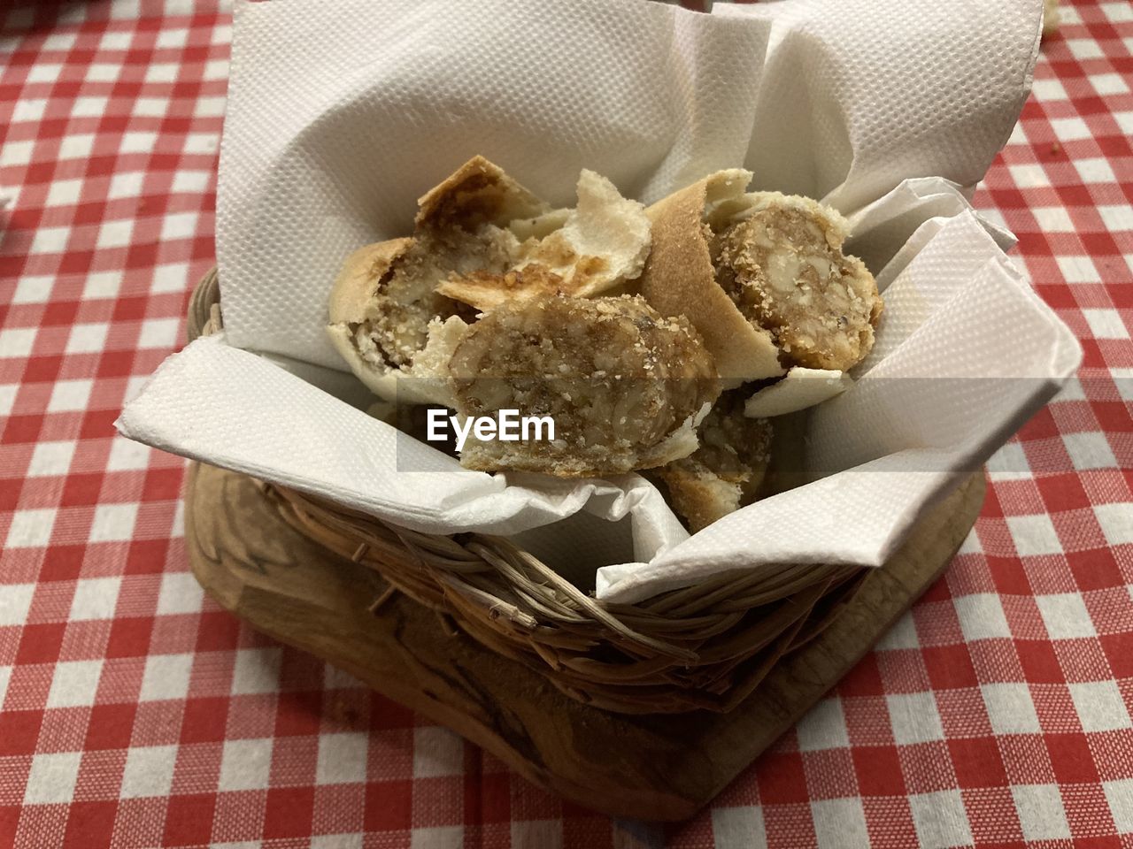 food and drink, food, checked pattern, tablecloth, basket, container, indoors, no people, freshness, high angle view, dessert, textile, still life, snack, dish towel, dish, napkin, produce, bread, table, healthy eating, meal, wellbeing, baked