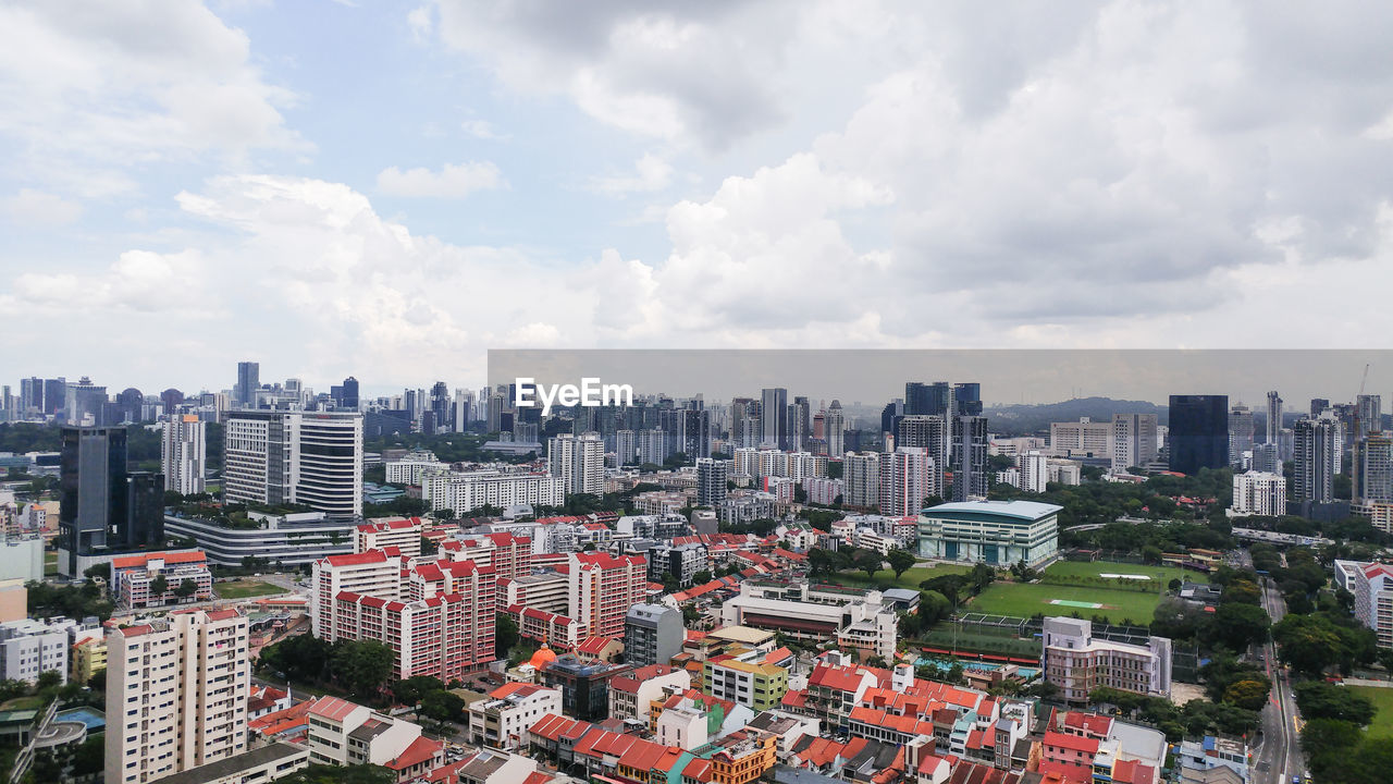 HIGH ANGLE VIEW OF BUILDINGS AGAINST SKY