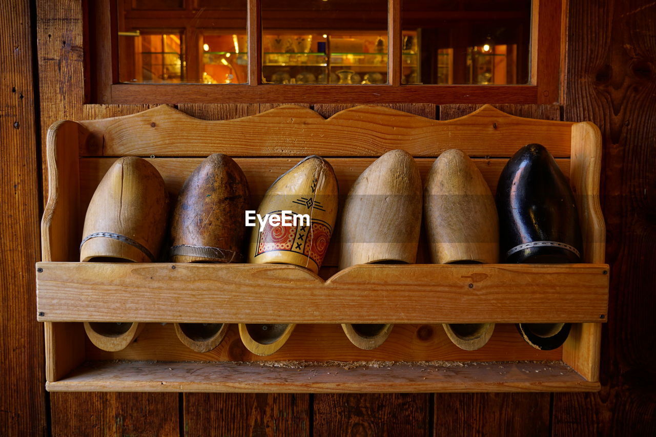 Wooden shoes on shelf