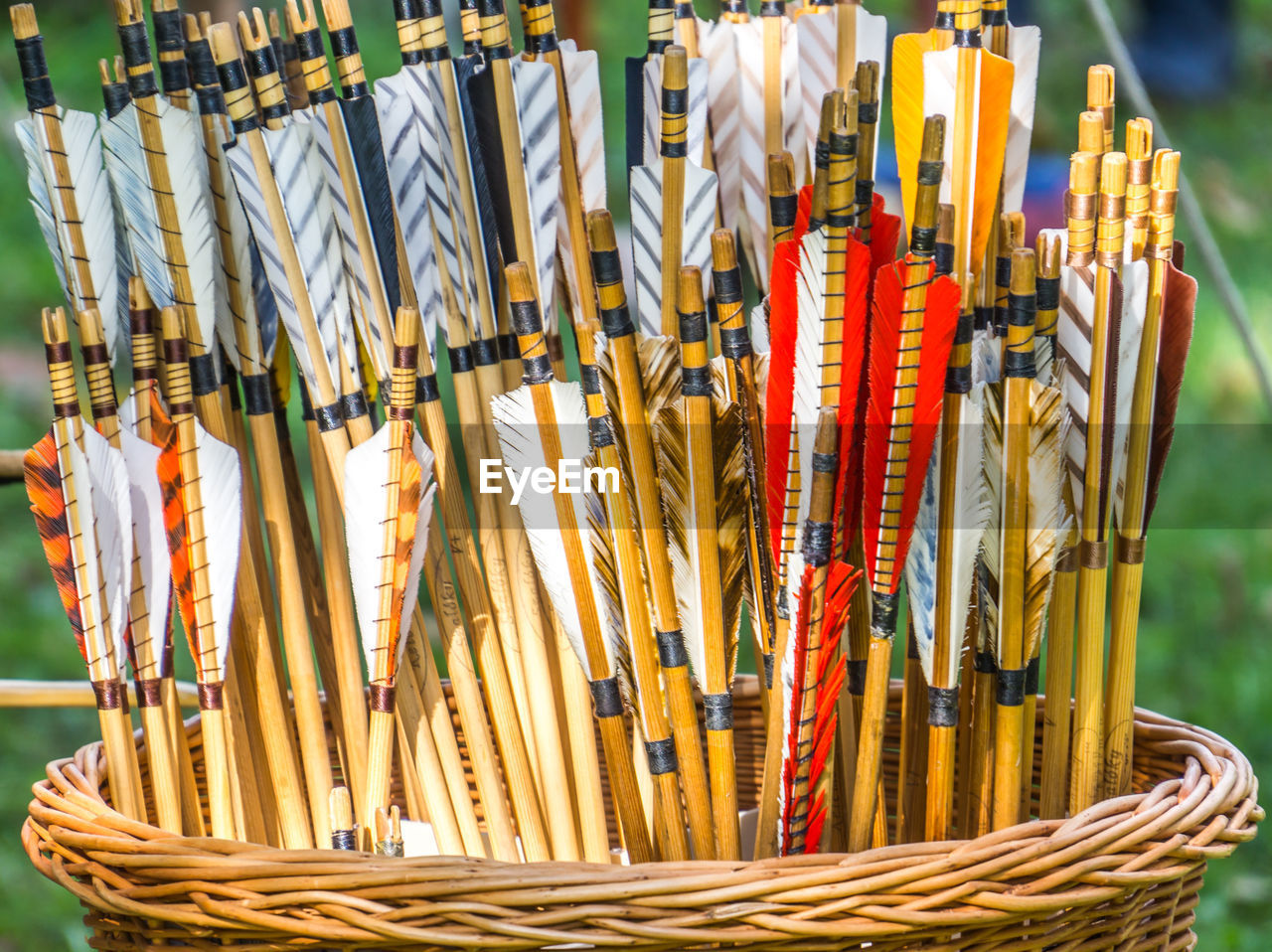 Close-up of arrows in wicker basket