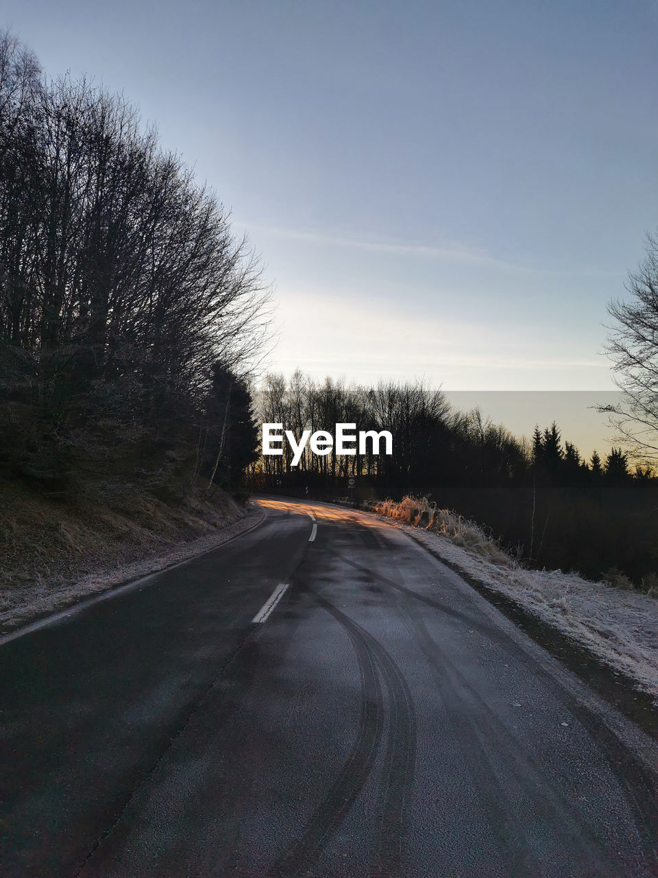 EMPTY ROAD AGAINST SKY