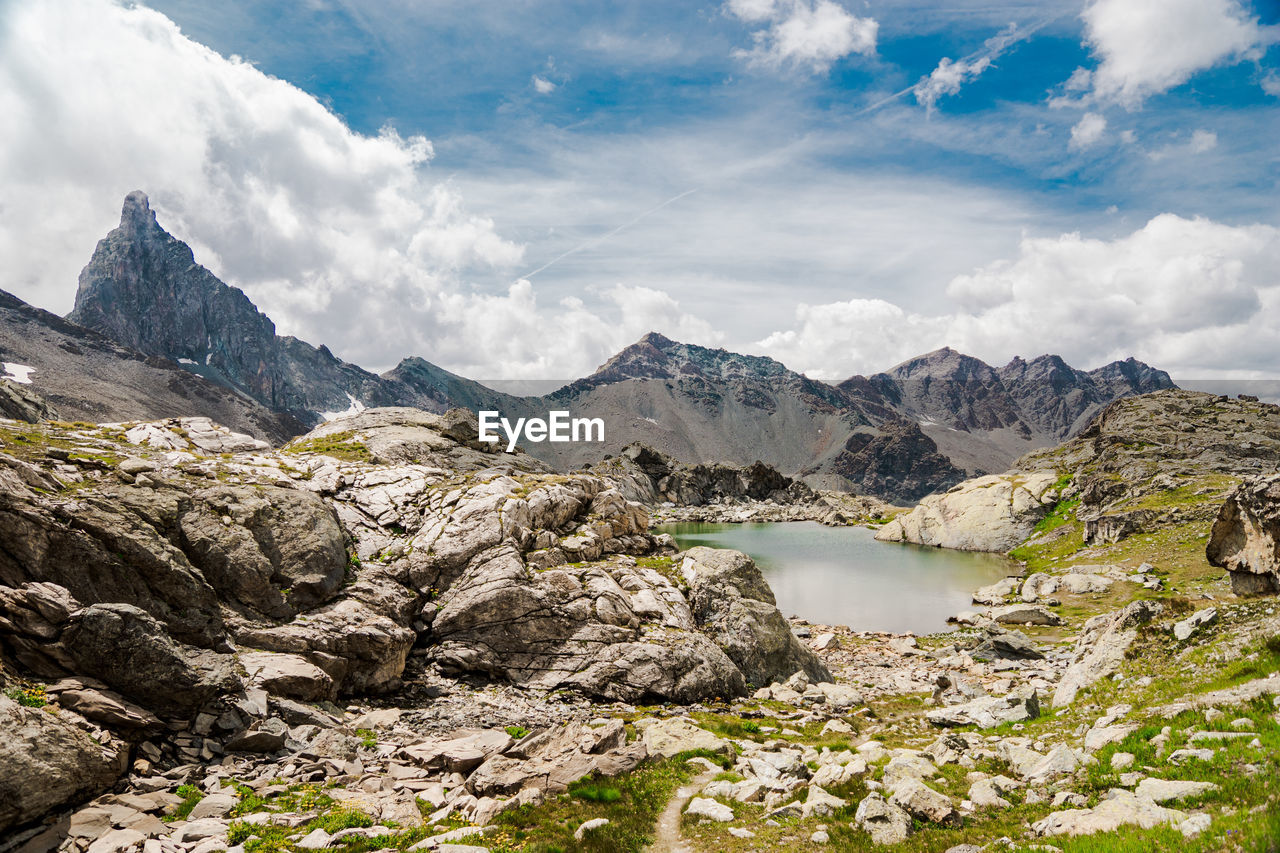 Scenic view of lake and mountains against sky