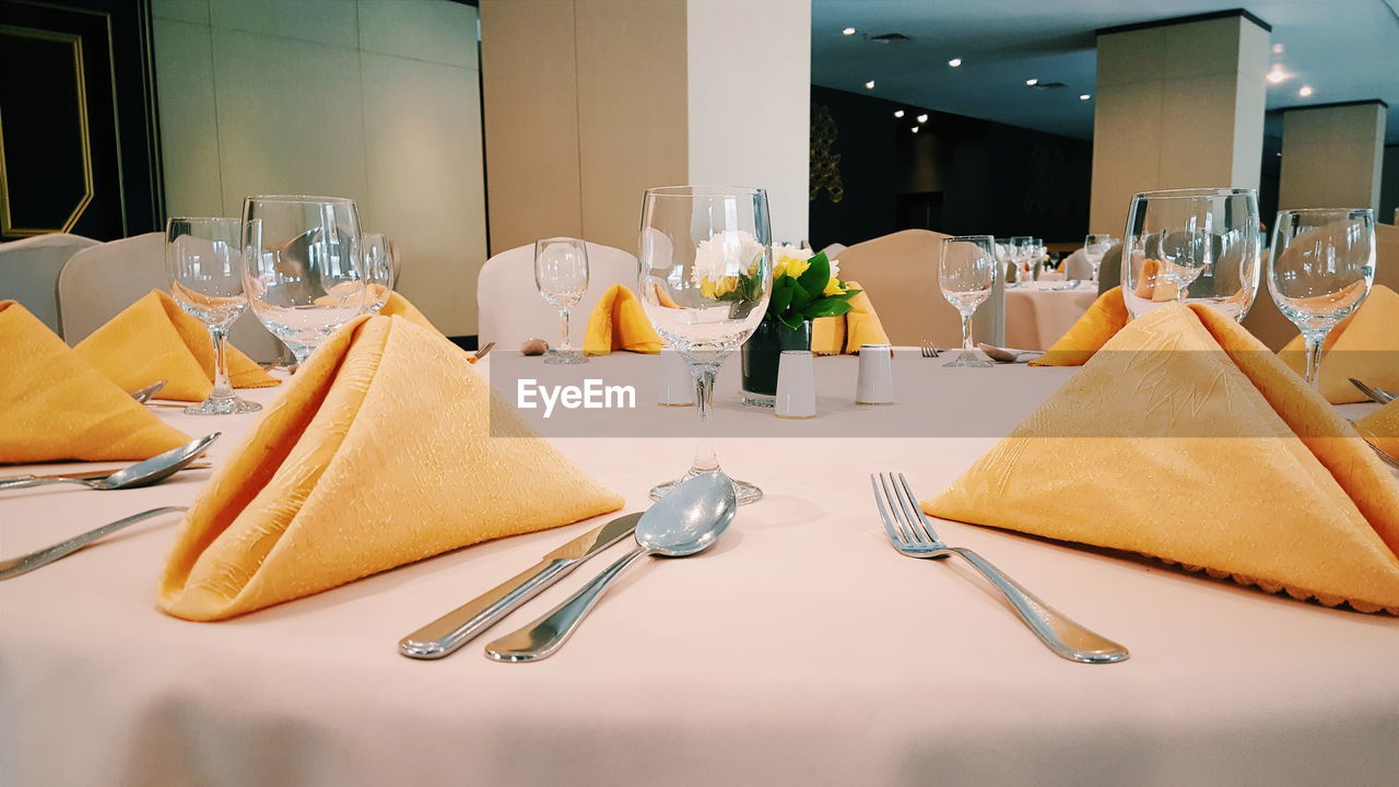 Place setting on table at restaurant