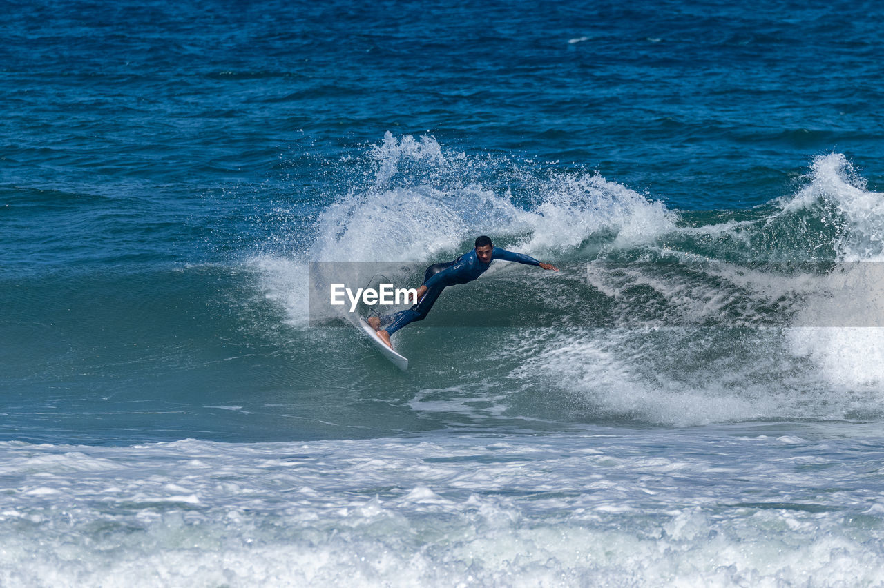 high angle view of man surfing in sea