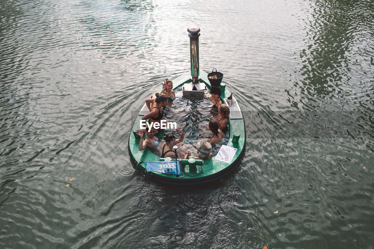 HIGH ANGLE VIEW OF BOAT IN WATER