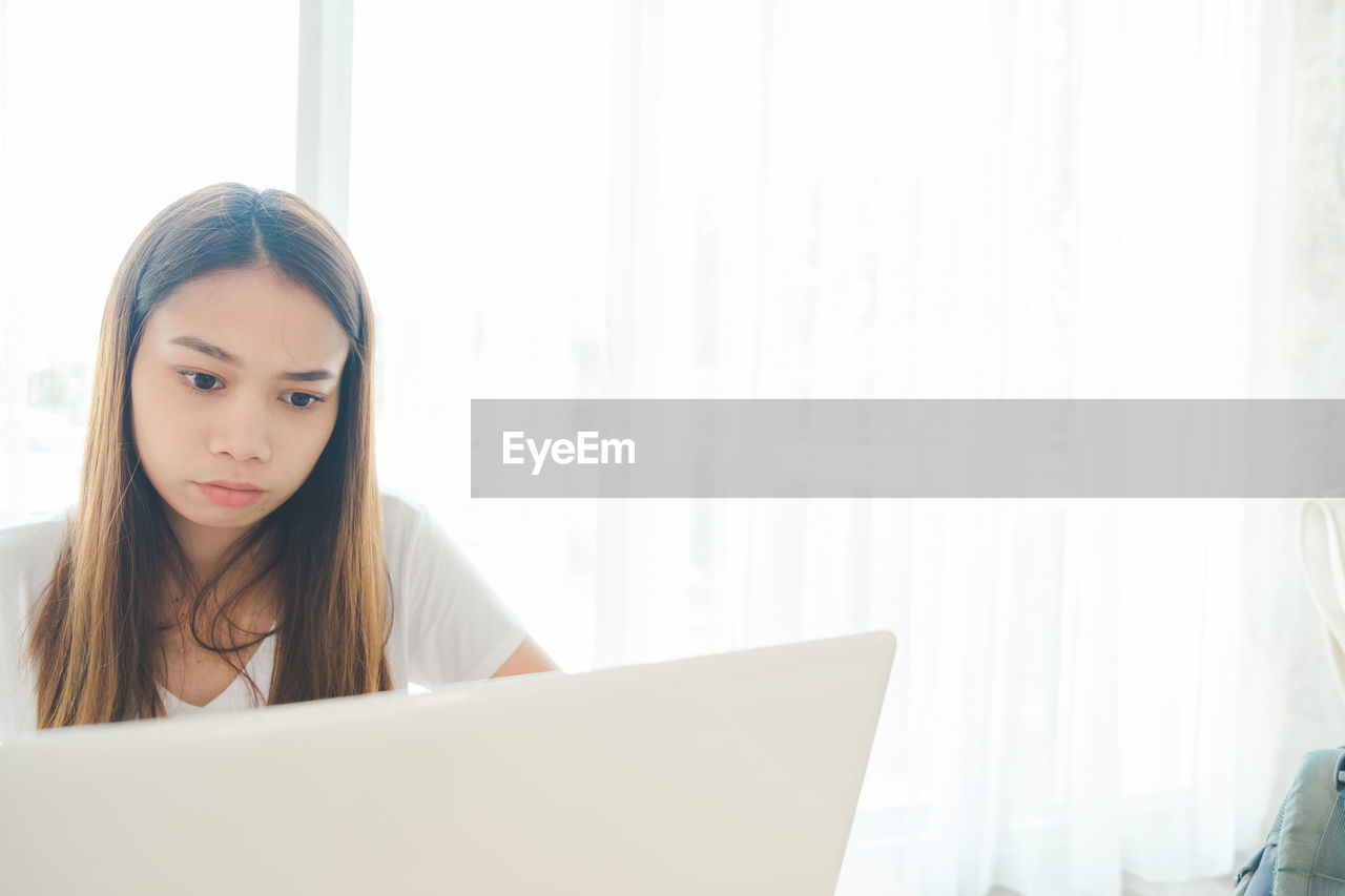 Young woman using laptop