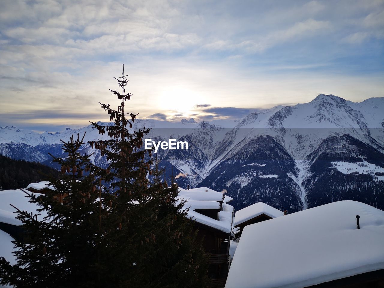 Scenic view of snowcapped mountains against sky