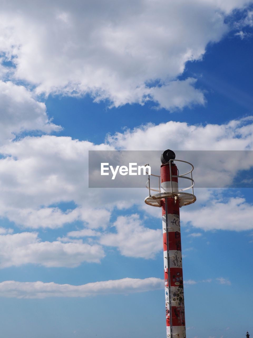 Low angle view of communications tower against sky