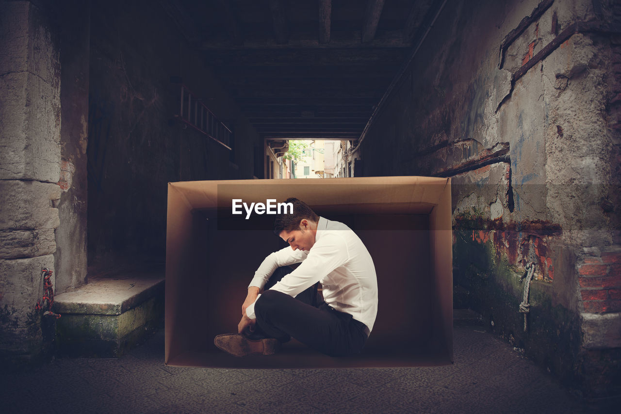 Man sitting in box