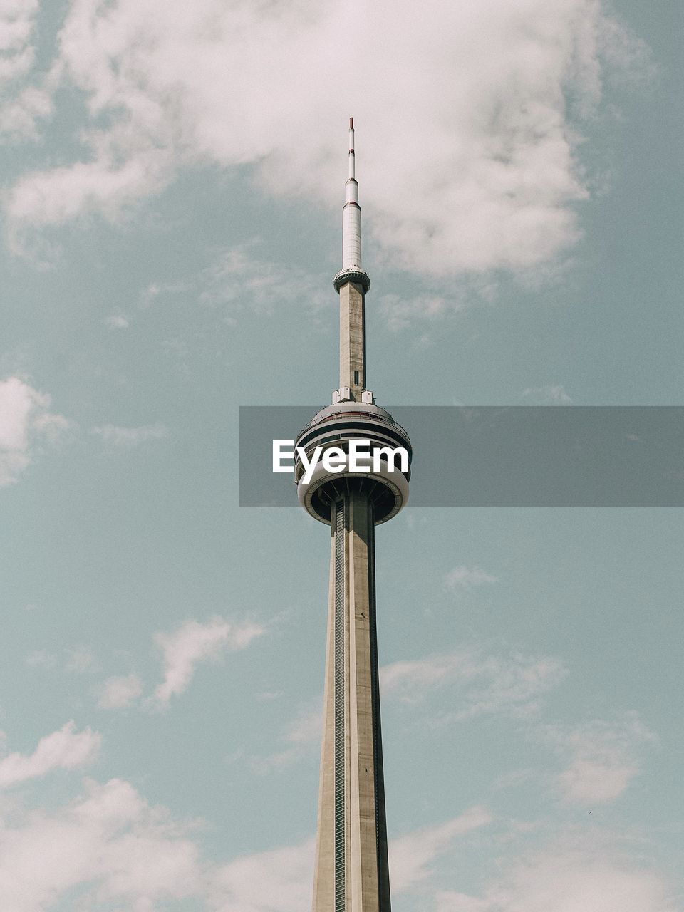 Low angle view of communications tower against sky