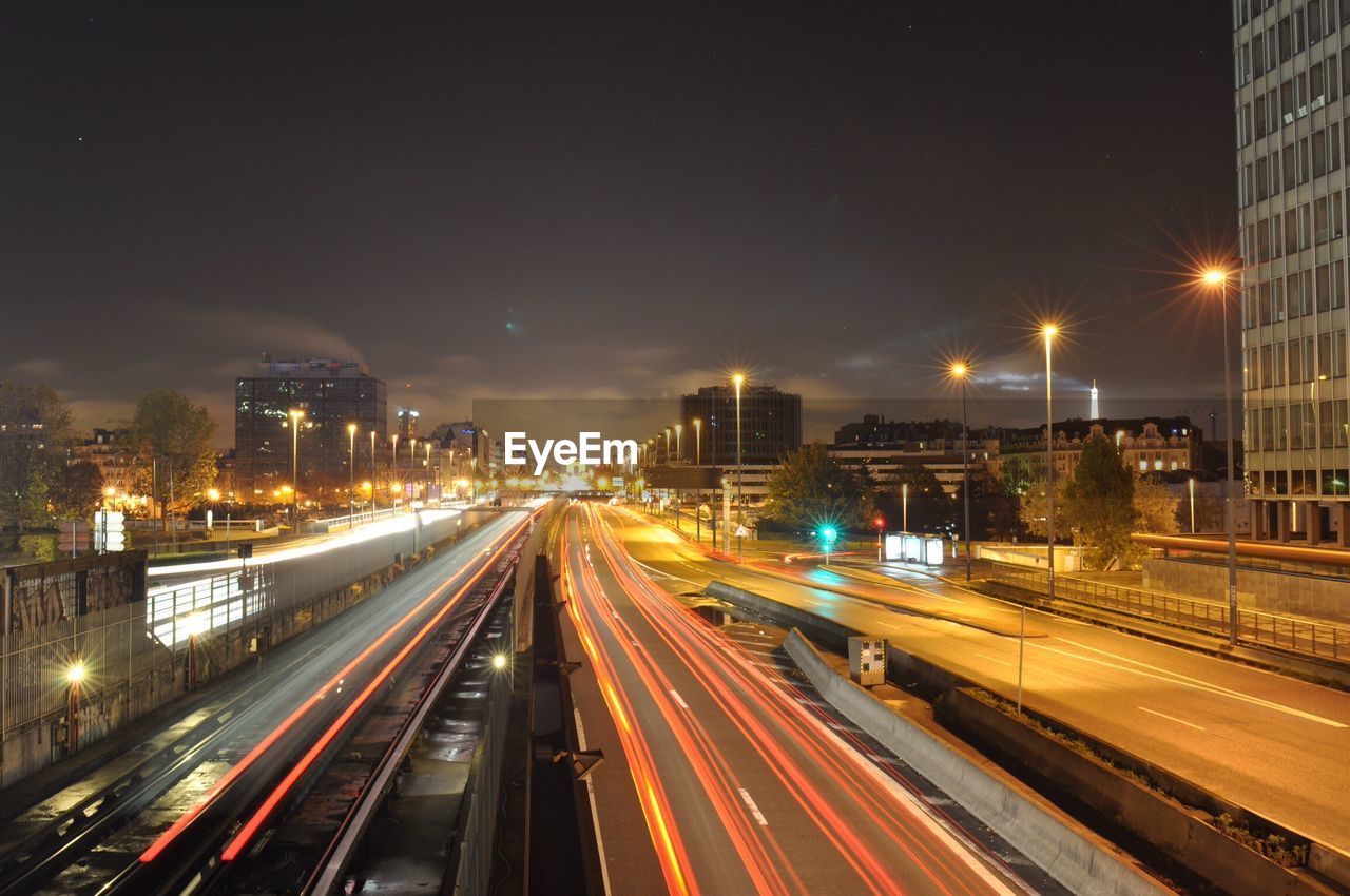 High angle view of light trails on highway at night