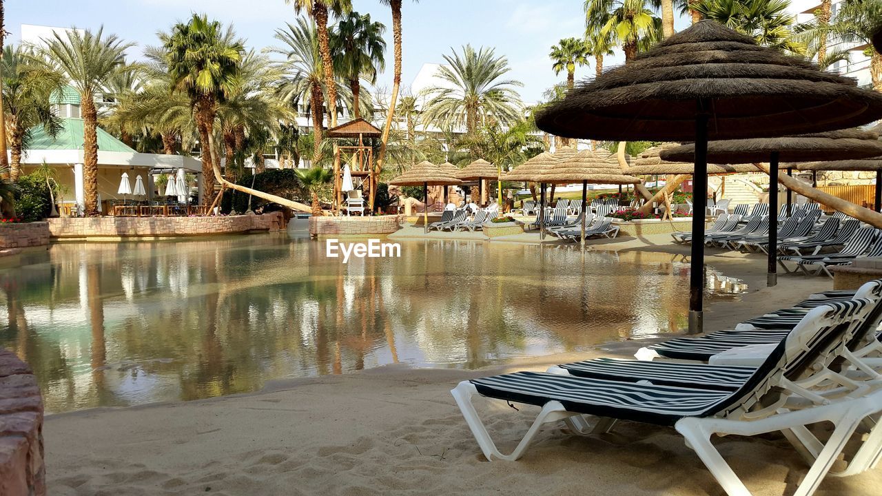 Deck chairs with parasols in resort