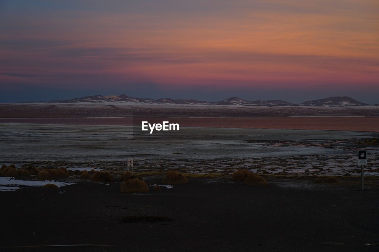 Scenic view of lake during sunset