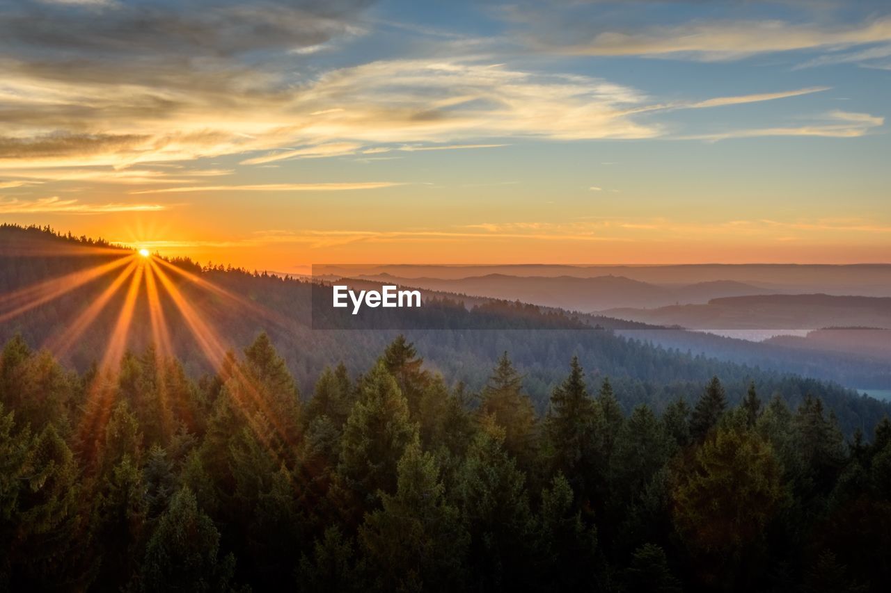 Scenic view of landscape against sky during sunset