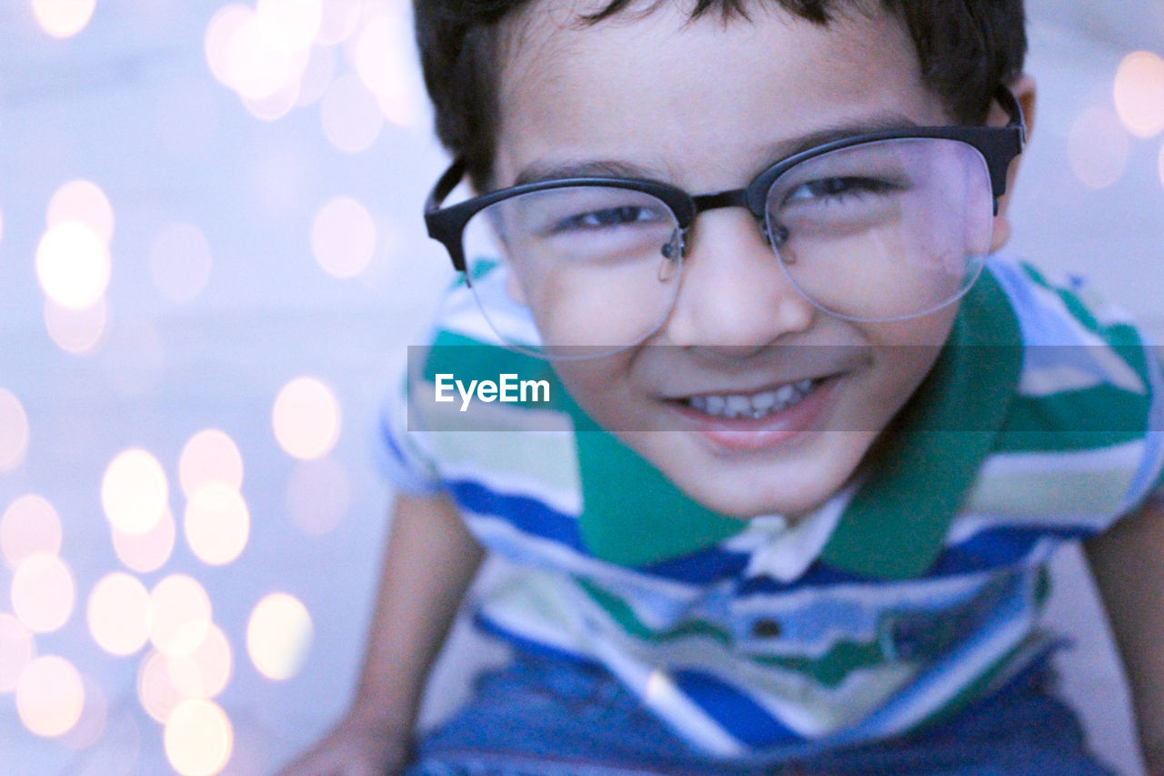 Portrait of smiling cute boy wearing eyeglasses