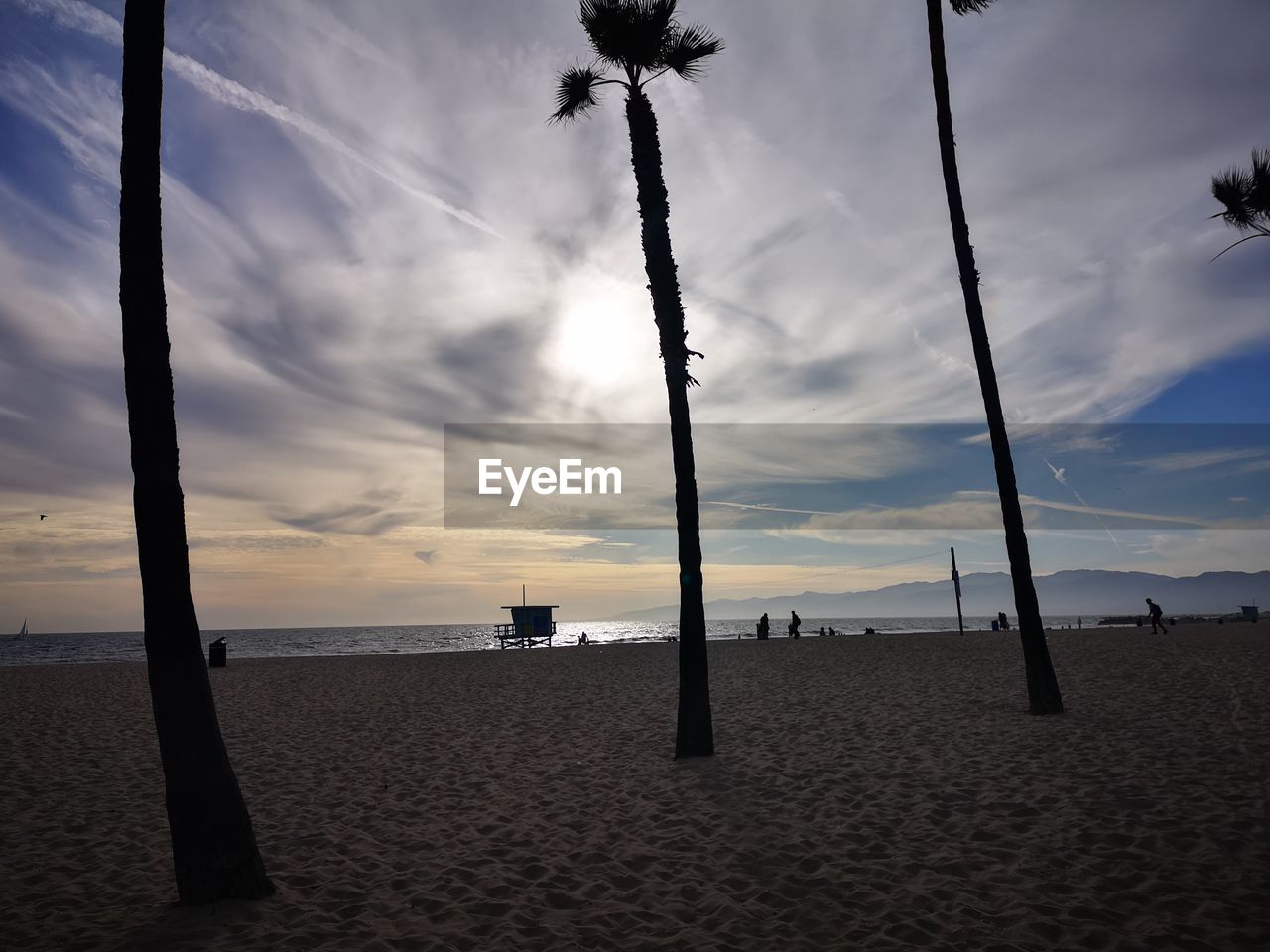 SCENIC VIEW OF BEACH DURING SUNSET