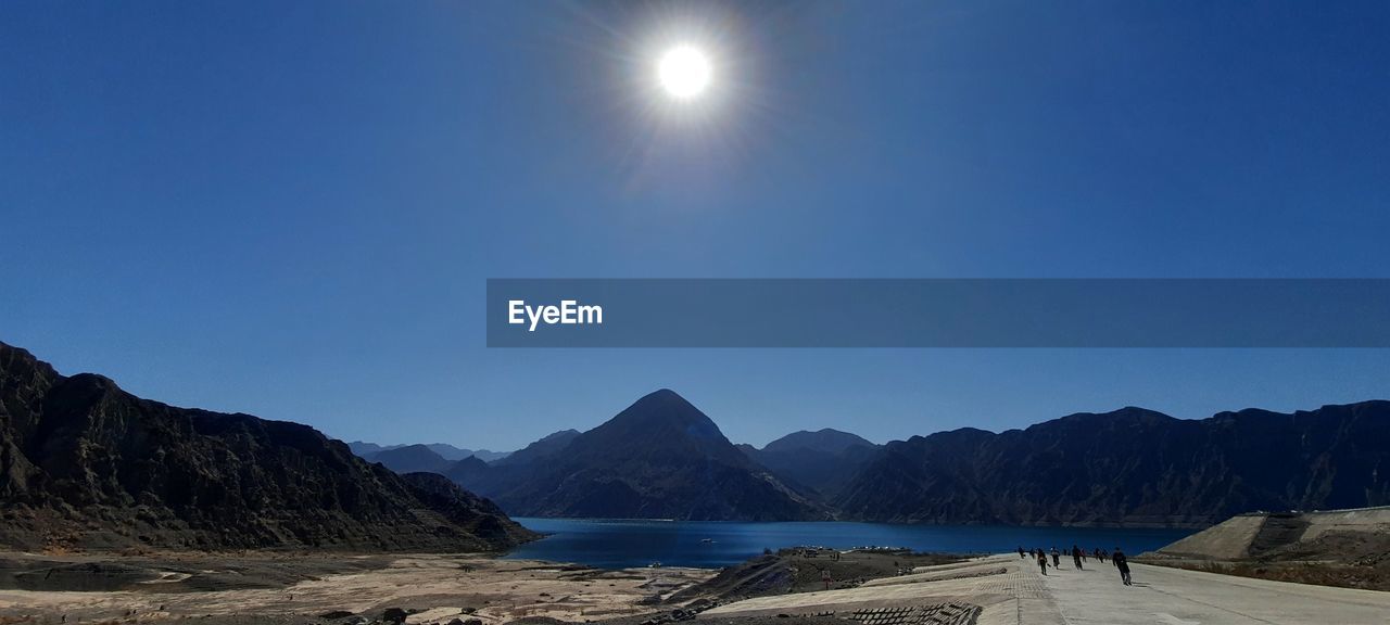 SCENIC VIEW OF MOUNTAINS AGAINST BLUE SKY