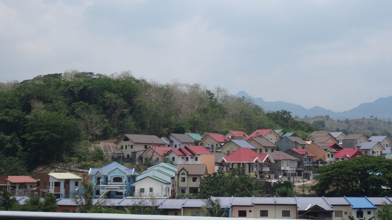 HOUSES AGAINST SKY