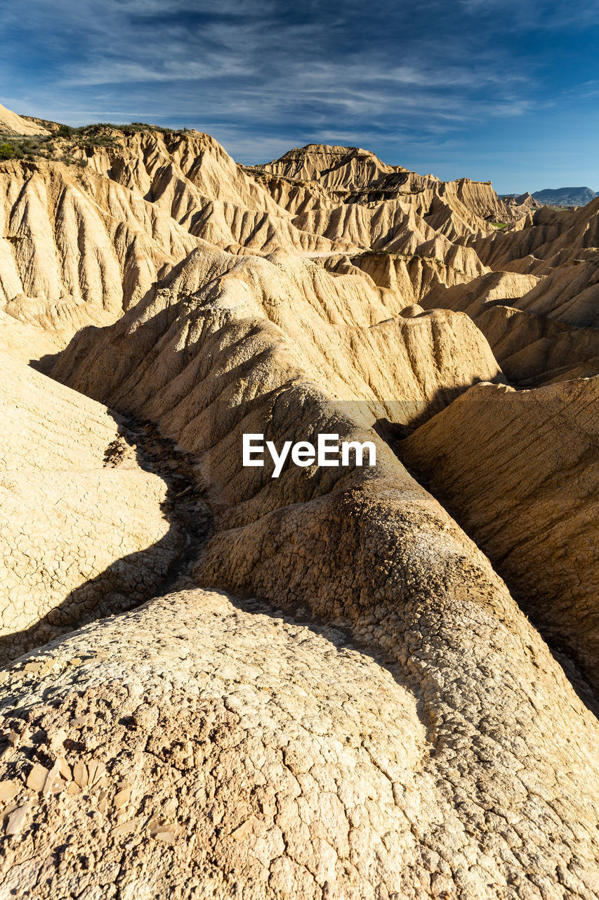 Rock formation on land against sky