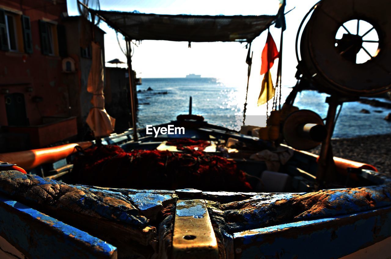 Close-up of boats moored in sea