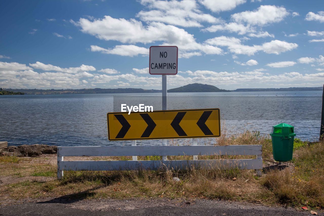 Warning sign against lake