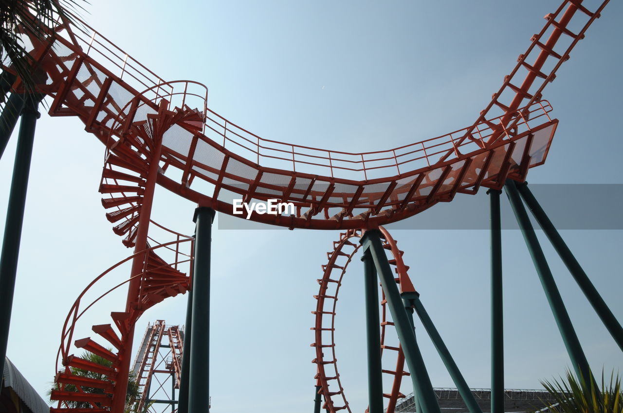 Low angle view of rollercoaster against sky