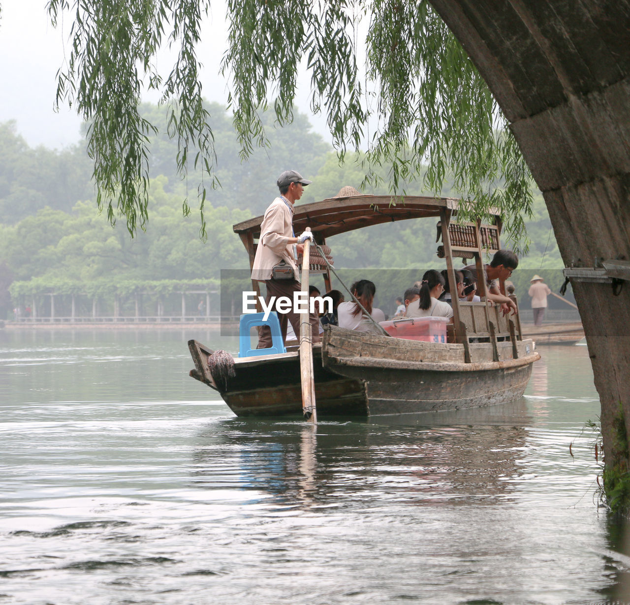 PEOPLE IN BOAT AT LAKE