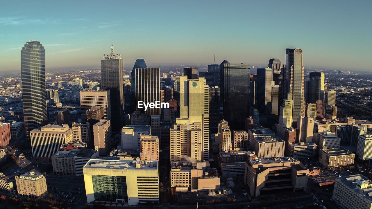 Aerial view of modern buildings in city against sky