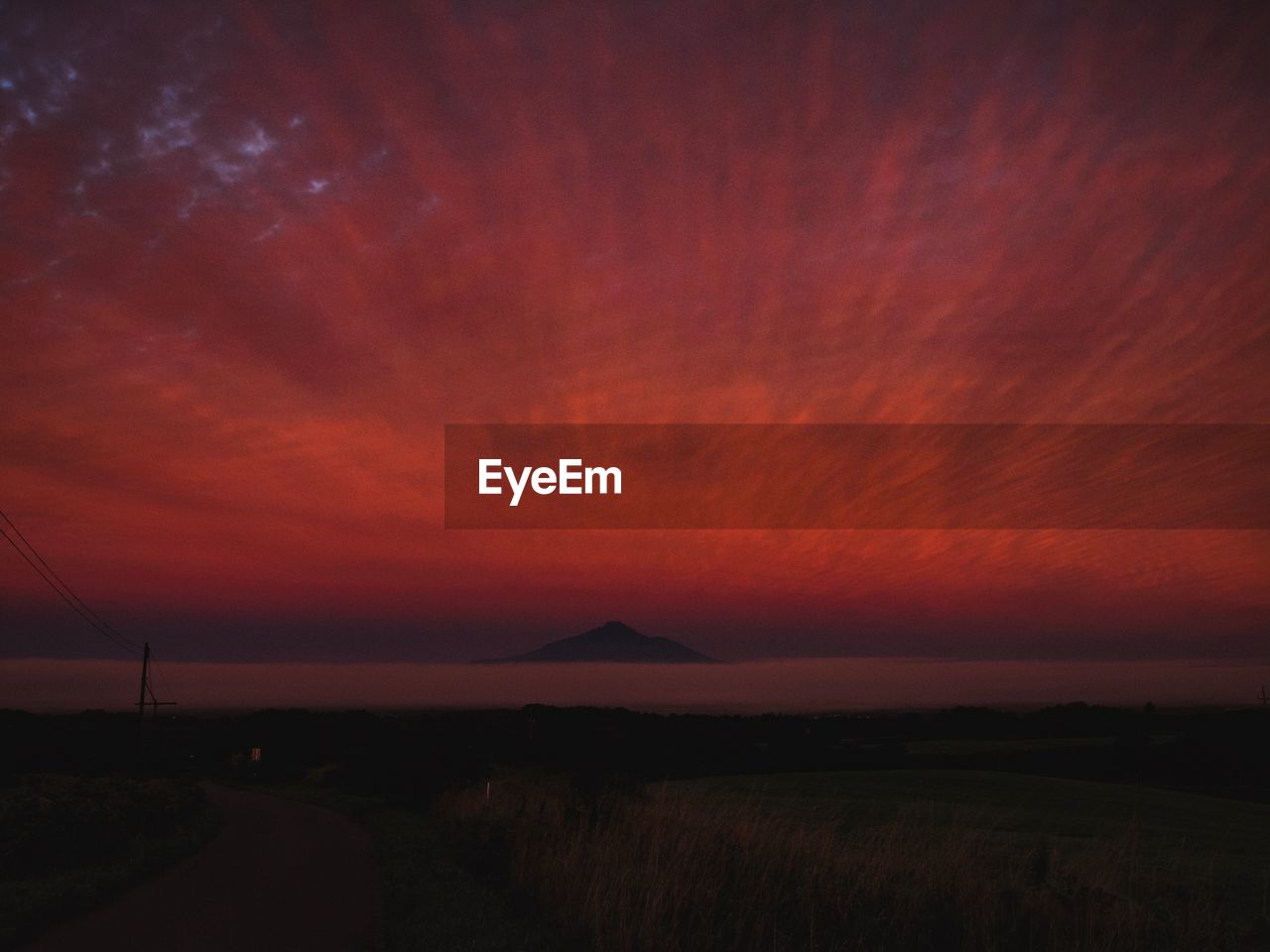 SCENIC VIEW OF DRAMATIC SKY OVER SILHOUETTE LANDSCAPE