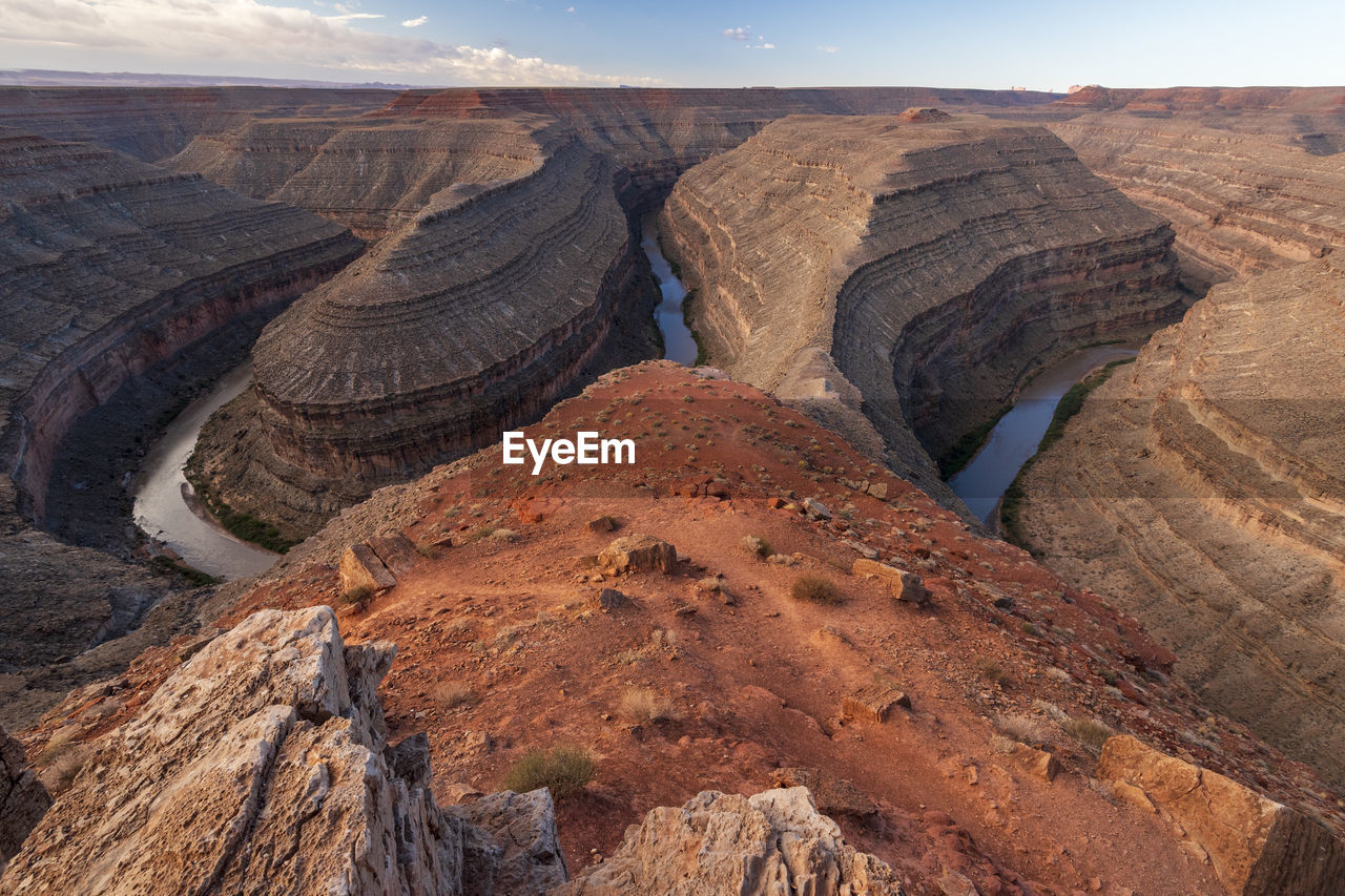 Rock formations on landscape against sky