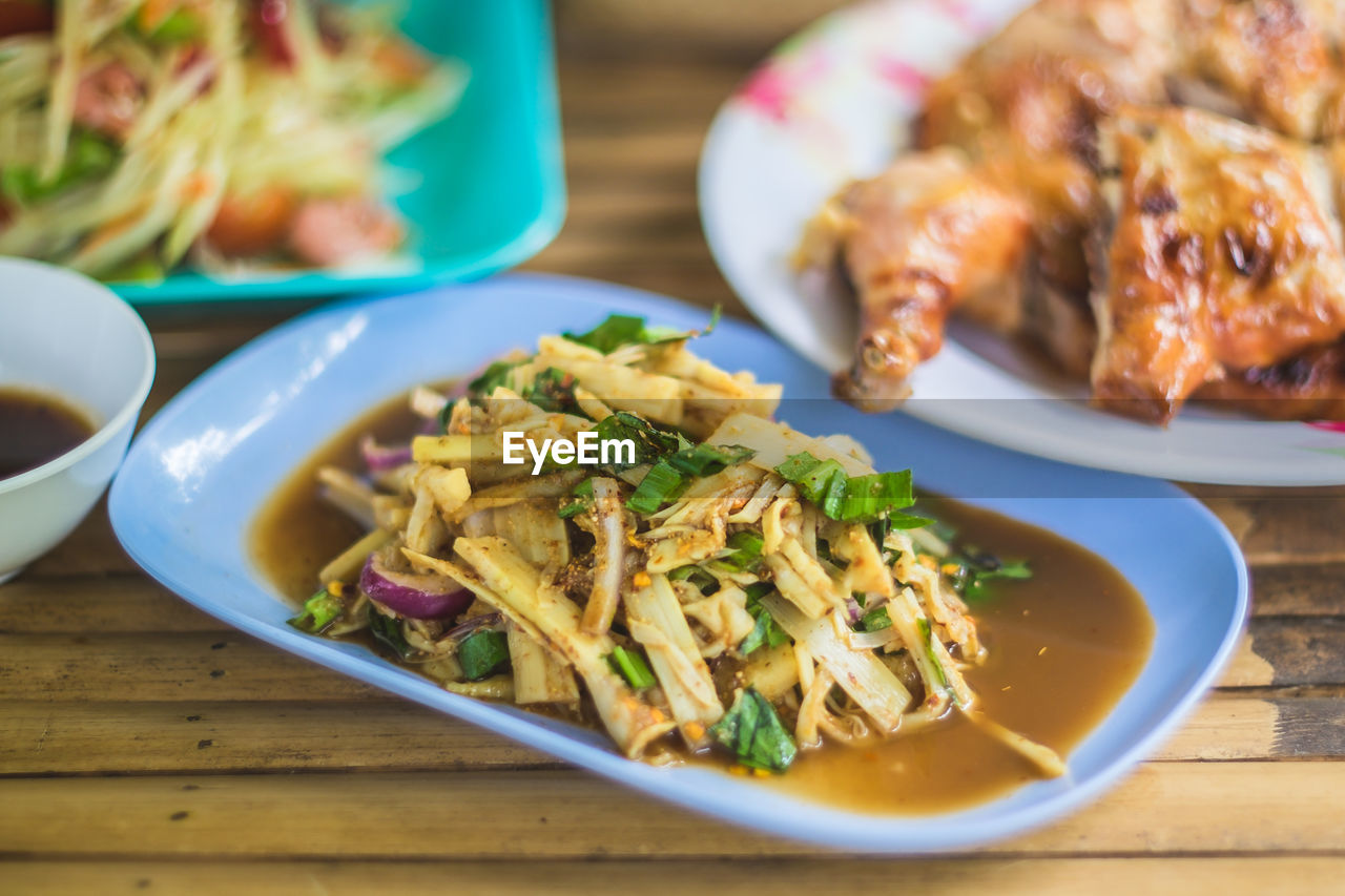 Close-up of food served in plates on table