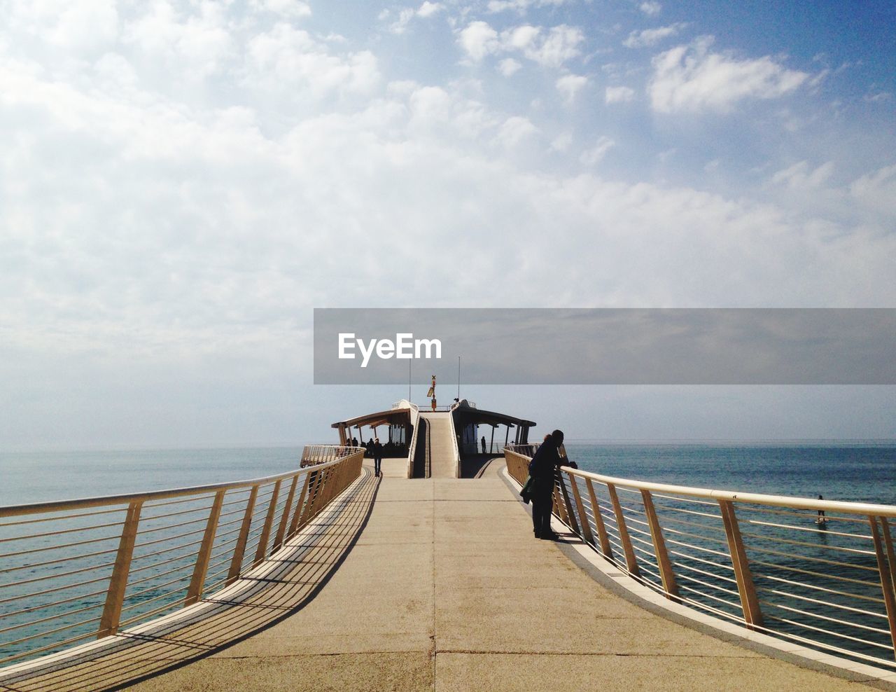 SCENIC VIEW OF BRIDGE OVER SEA AGAINST SKY