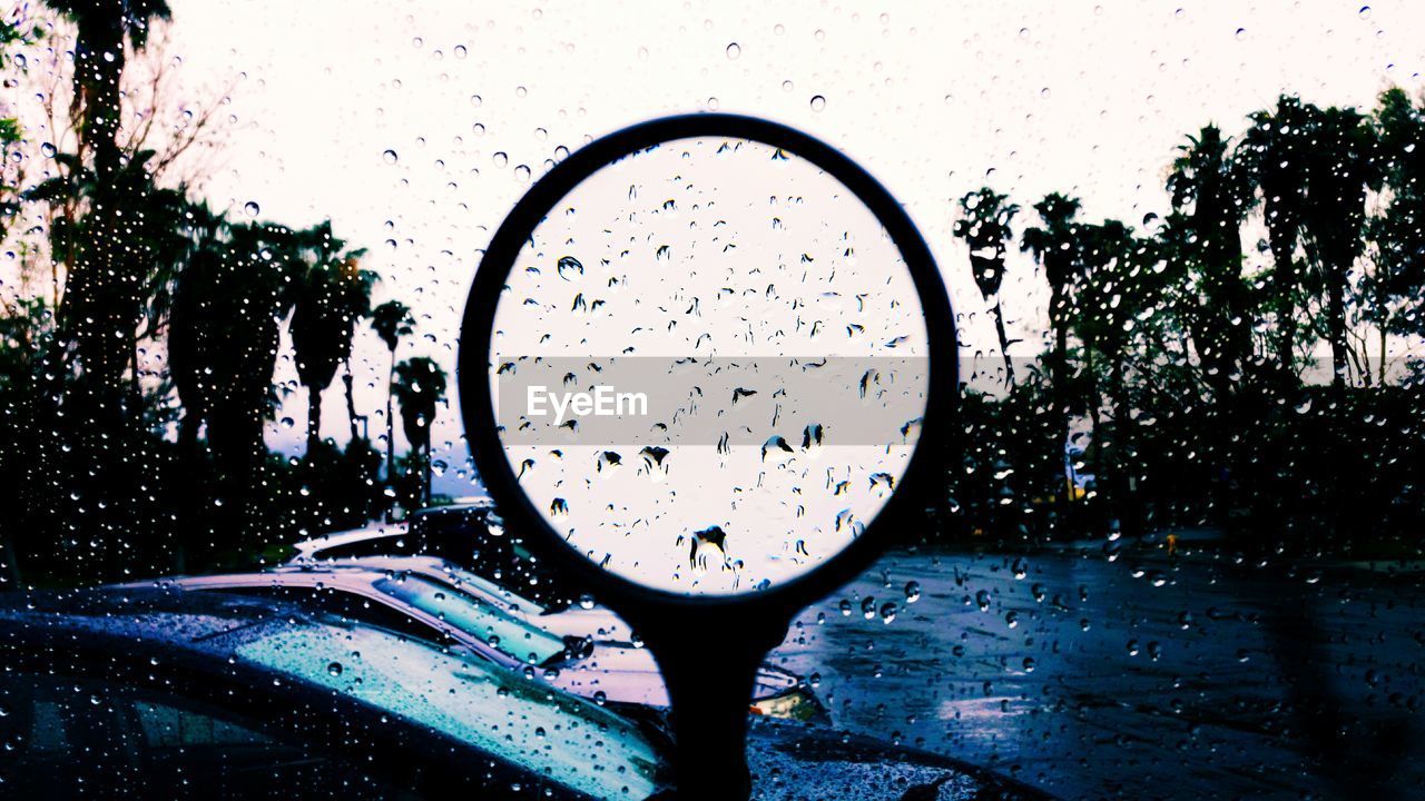 Close-up of water drops on magnifying glass