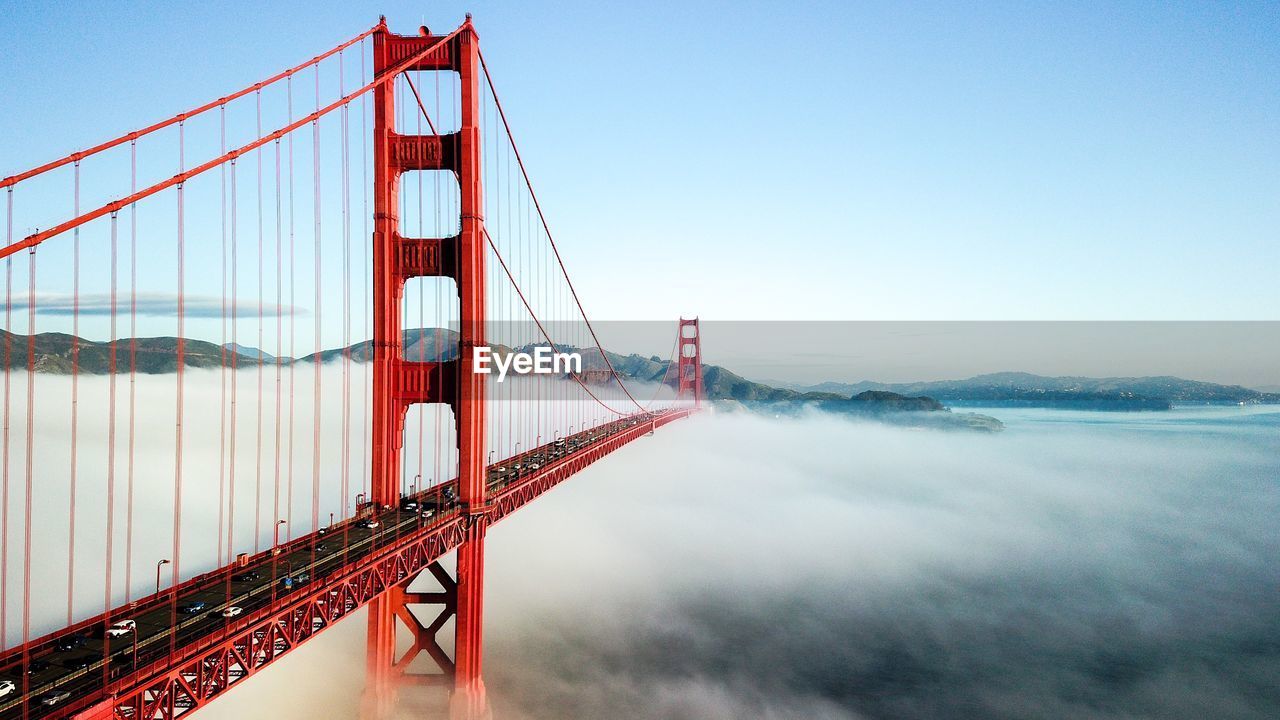 Golden gate bridge over river against sky