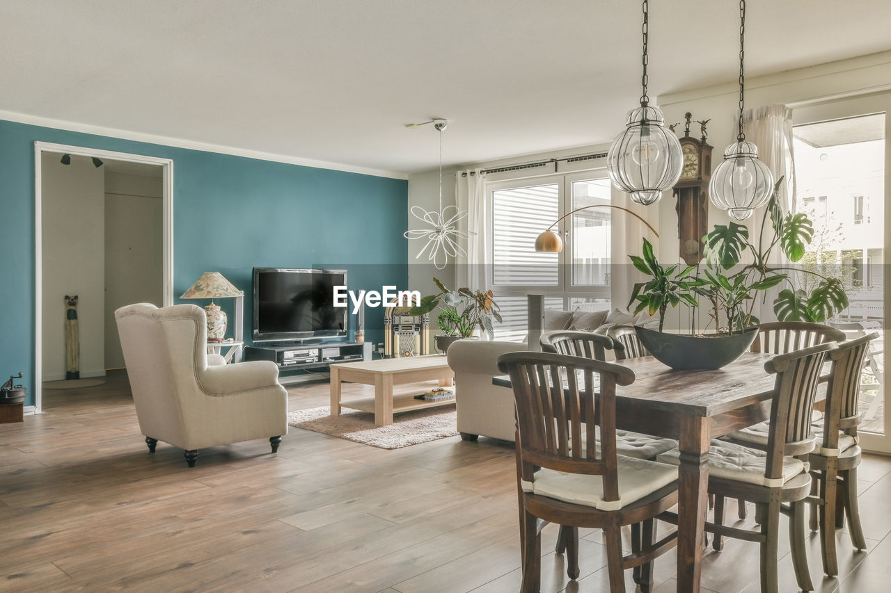 Empty chairs and tables and table and chair on floor at home