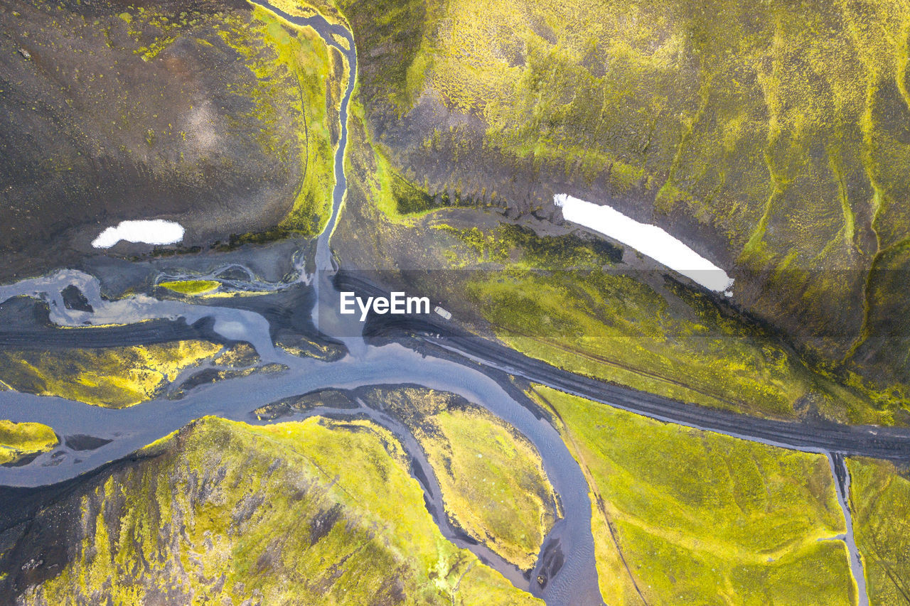 HIGH ANGLE VIEW OF WATER FALLING ON LAND